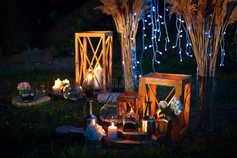 Night wedding ceremony with a lot of lights, candles, lanterns. Beautiful romantic shining decorations in twilight royalty free stock photography Night wedding ceremony with a lot of lights, candles, lanterns. Beautiful romantic shining decorations in twilight royalty free stock photography