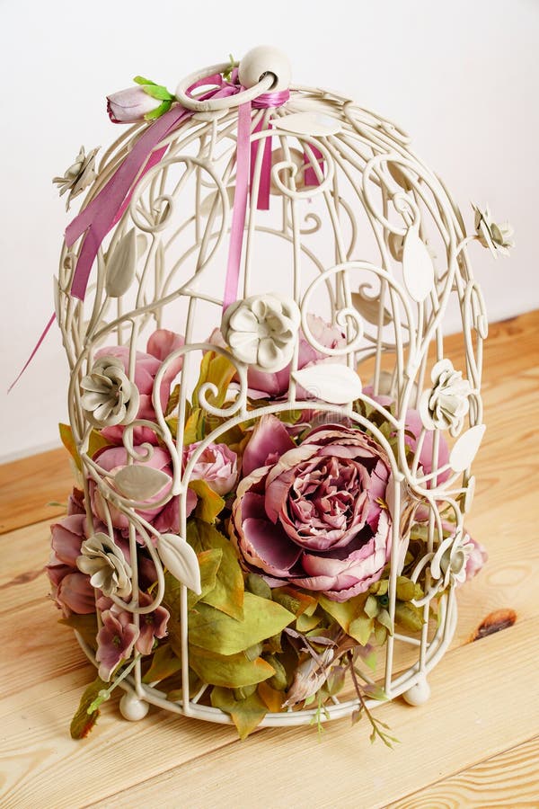 Decorative Cage with a Composition of Artificial Flowers. Stock Image