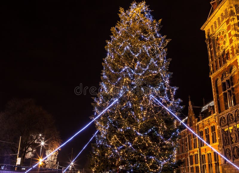 Decorative Christmas decorations on streets of night Amsterdam.