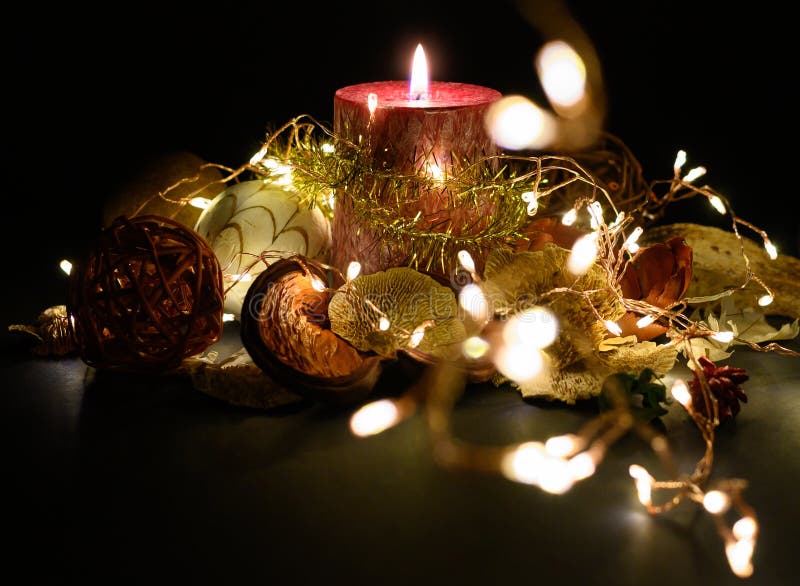 A Decorative Christmas Display with Candle and Lights Stock Photo