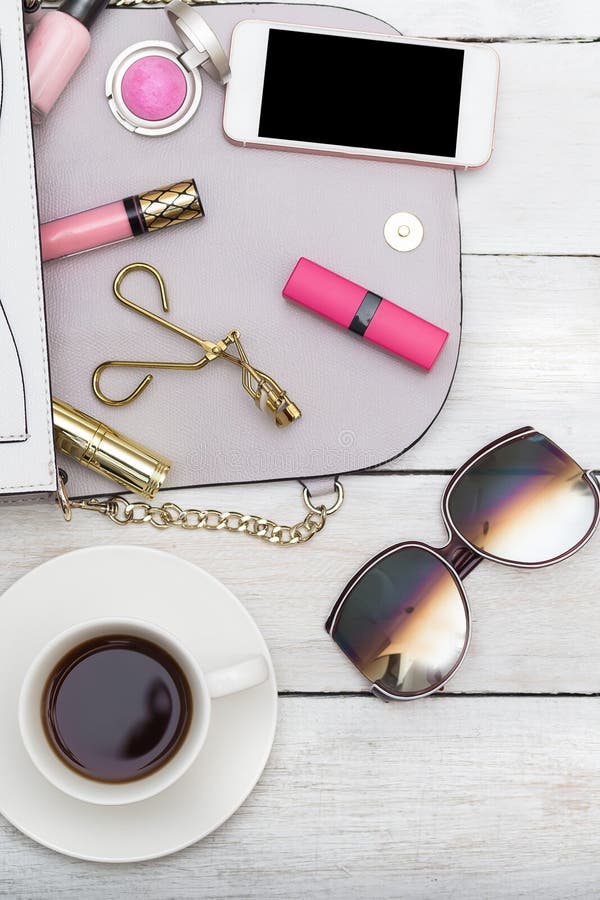 Decorative cosmetics, bag and phone. vertical Photo stock photo