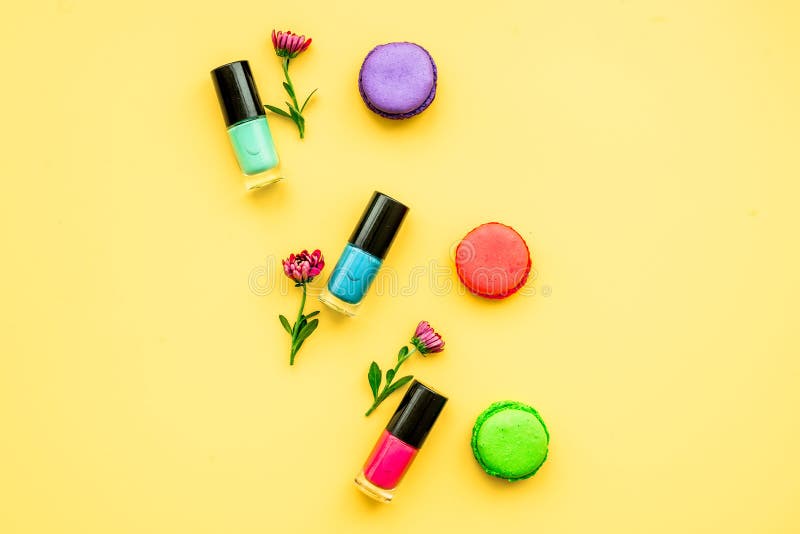 Decorative cosmetics on yellow background top view royalty free stock photo