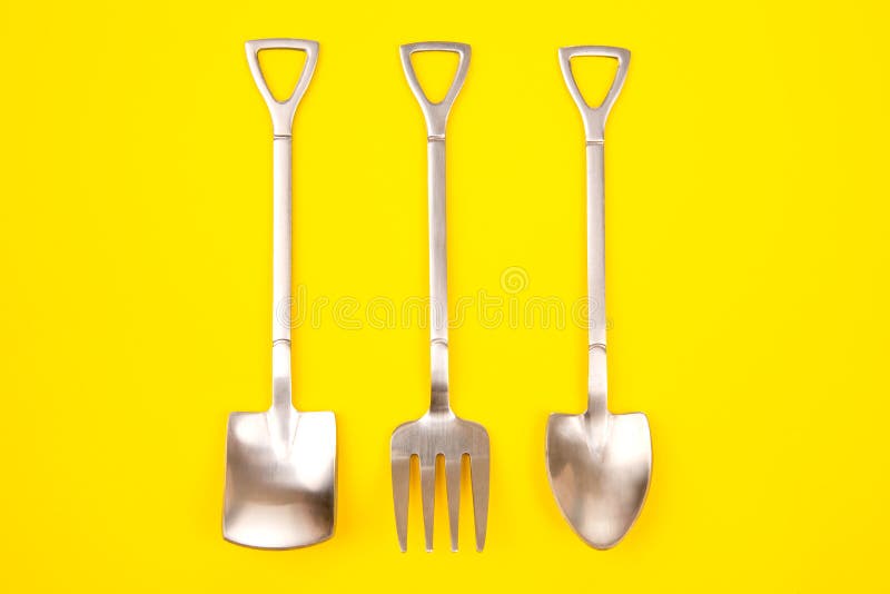 Decorative Fork and Spoons in the Form of Spades on a Colored