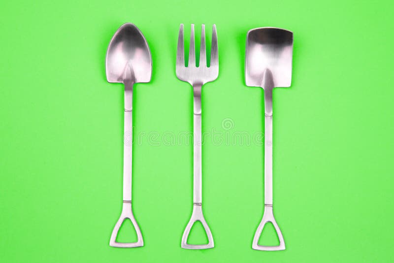 Decorative Fork and Spoons in the Form of Spades on a Colored