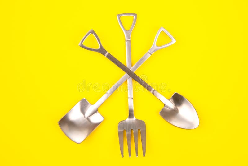 Decorative Fork and Spoons in the Form of Spades on a Colored