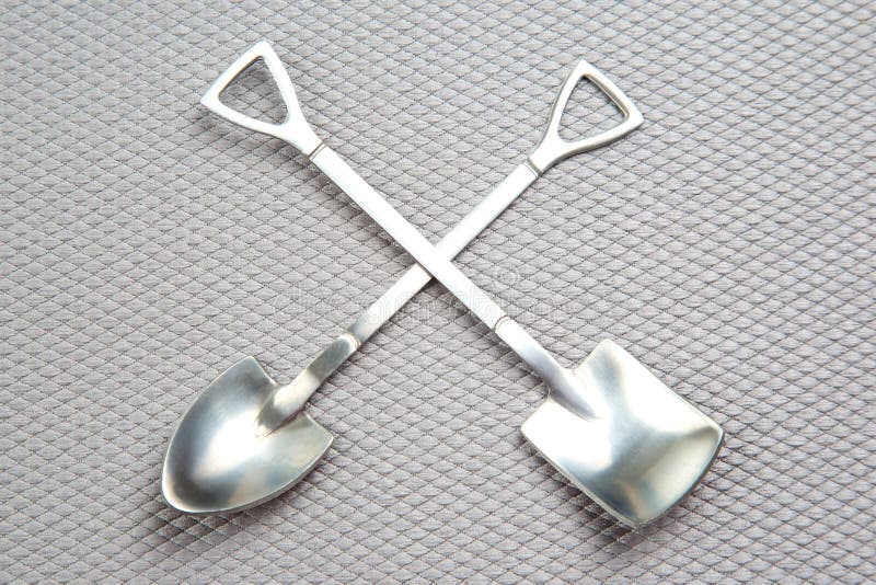 Decorative Fork and Spoons in the Form of Spades on a Gray Background