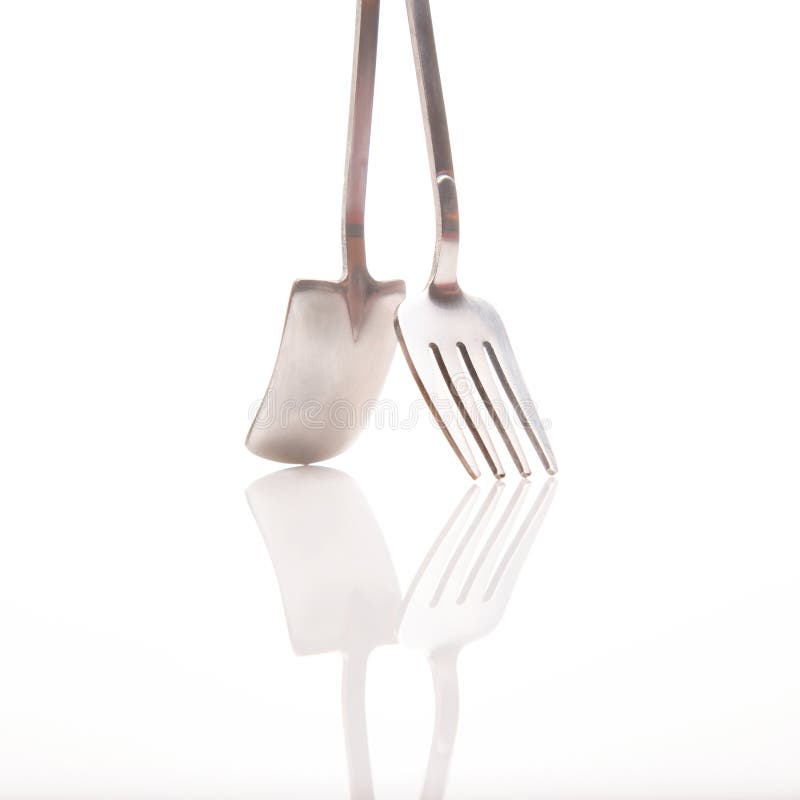 Decorative Fork and Spoons in the Form of Spades on a White Background