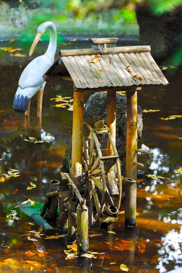 Decorative fountain of bamboo in the water , pond stock photos Decorative fountain of bamboo in the water , pond stock photos