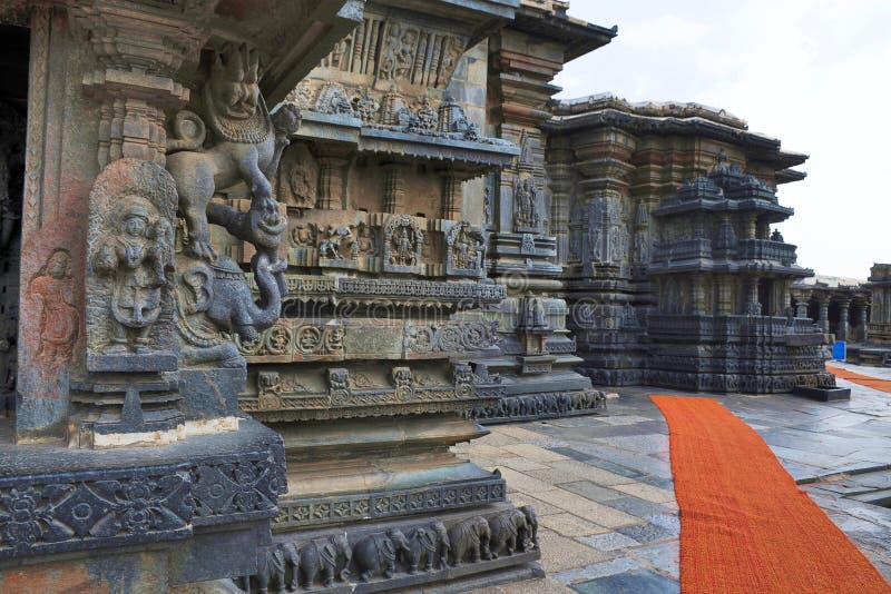 Decorative friezes with animal figures, and walls depicting Hindu deities. Chennakeshava temple. Belur, Karnataka. View from North