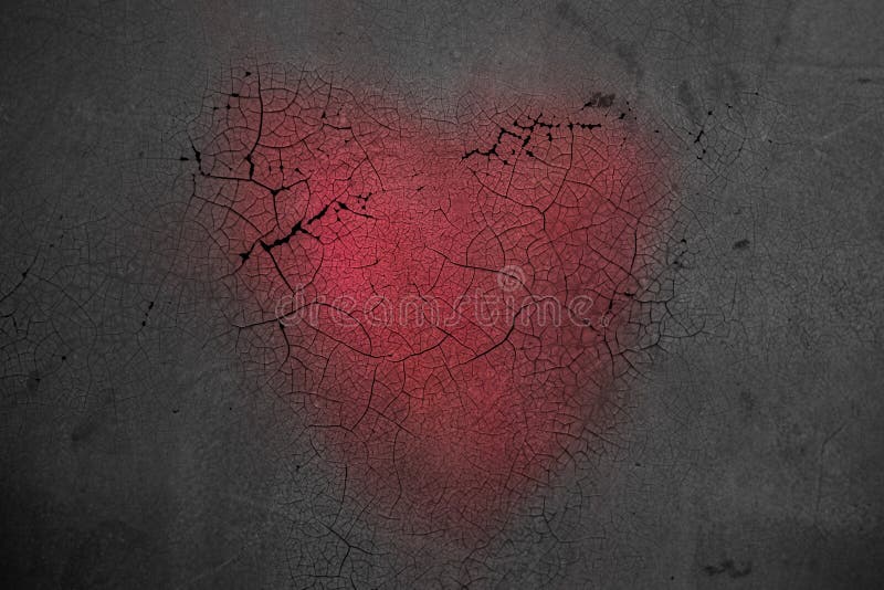 Decorative heart on dark wooden background with bright white light from the window. The concept of fading love. The end royalty free stock photography Decorative heart on dark wooden background with bright white light from the window. The concept of fading love. The end royalty free stock photography