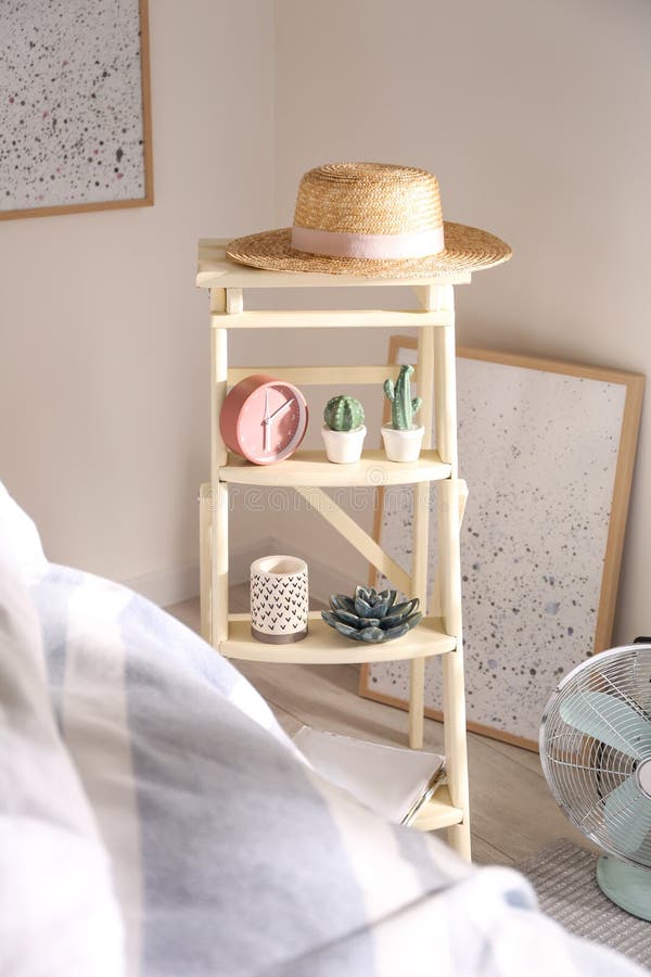 Decorative Ladder with Different Stuff in Stylish Bedroom. Idea for