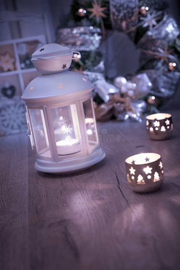 Decorative lantern, candles and Christmas decorations