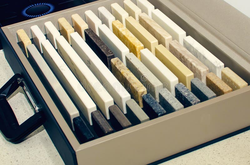 Decorative multicolored artificial stone in samples. Suitcase with samples of artificial stone. Finishing material, interior stock photo