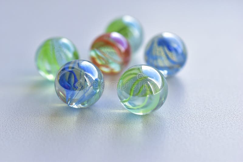 Decorative multicolored glass balls on a white background stock photos
