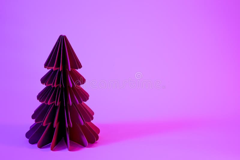 Decorative Paper Christmas Tree on Pink Background with Trendy Neon
