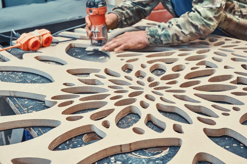 Decorative Partition Wall with Floral Pattern. Carpenter Milling Holes