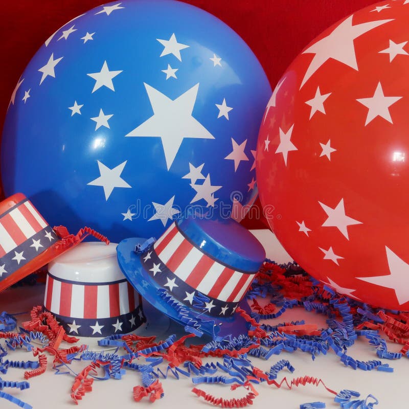 Three decorative party hats in patriotic colors of red, white, and blue colors and hatbands with the Stars and Stripes. Three decorative party hats in patriotic colors of red, white, and blue colors and hatbands with the Stars and Stripes