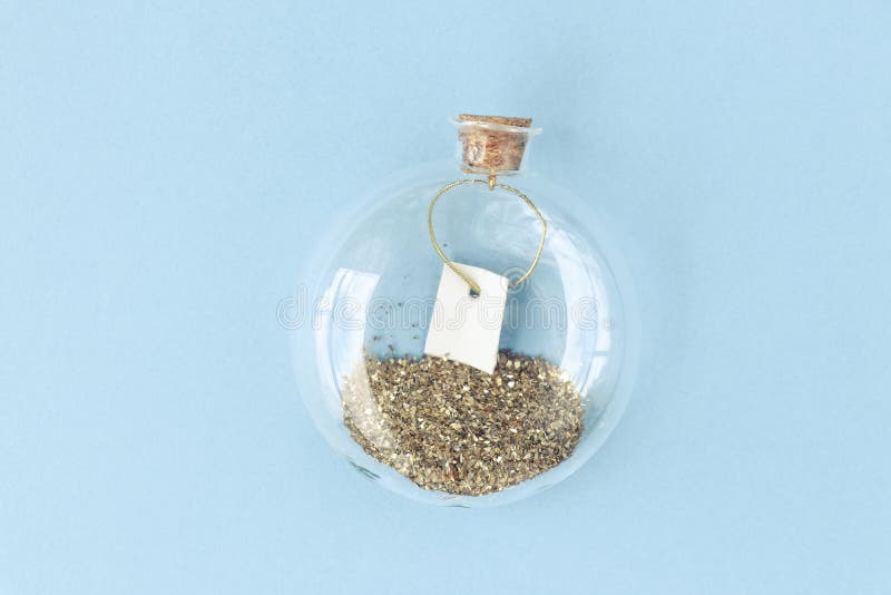 Decorative Round Bottle with Gold Glitter and Small Empty Blank. Magic