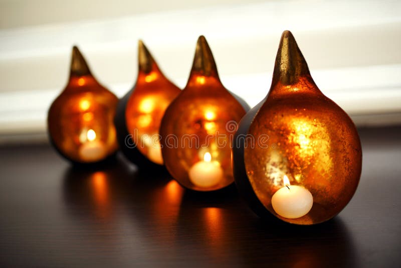 Decorative Round Copper Candlestick with Burning Candles Inside Stock