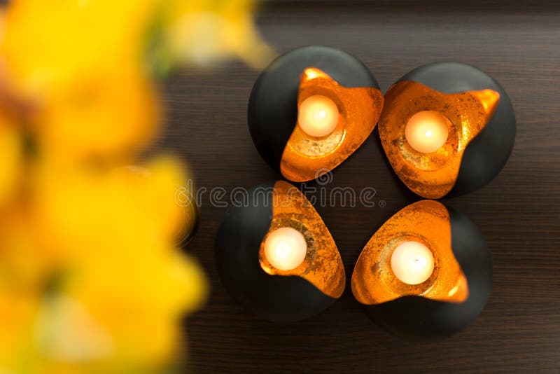 Decorative Round Copper Candlestick with Burning Candles Inside Stock