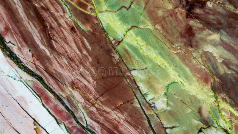 Decorative stone Jasper background macro view. Multi color natural mineral surface with a unique pattern and texture. royalty free stock photography Decorative stone Jasper background macro view. Multi color natural mineral surface with a unique pattern and texture. royalty free stock photography