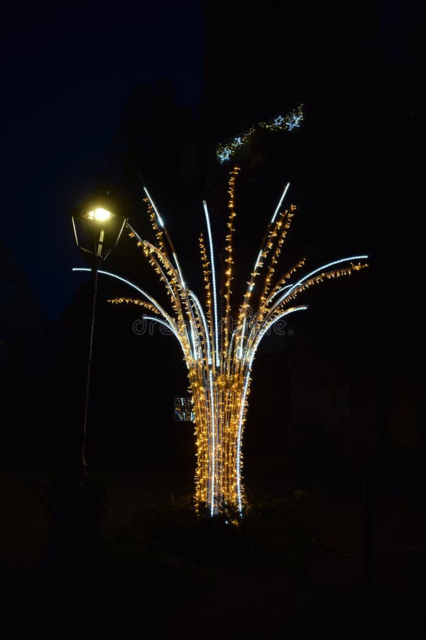 Christmas tree like decoration with a street lamp post at duck stock photos