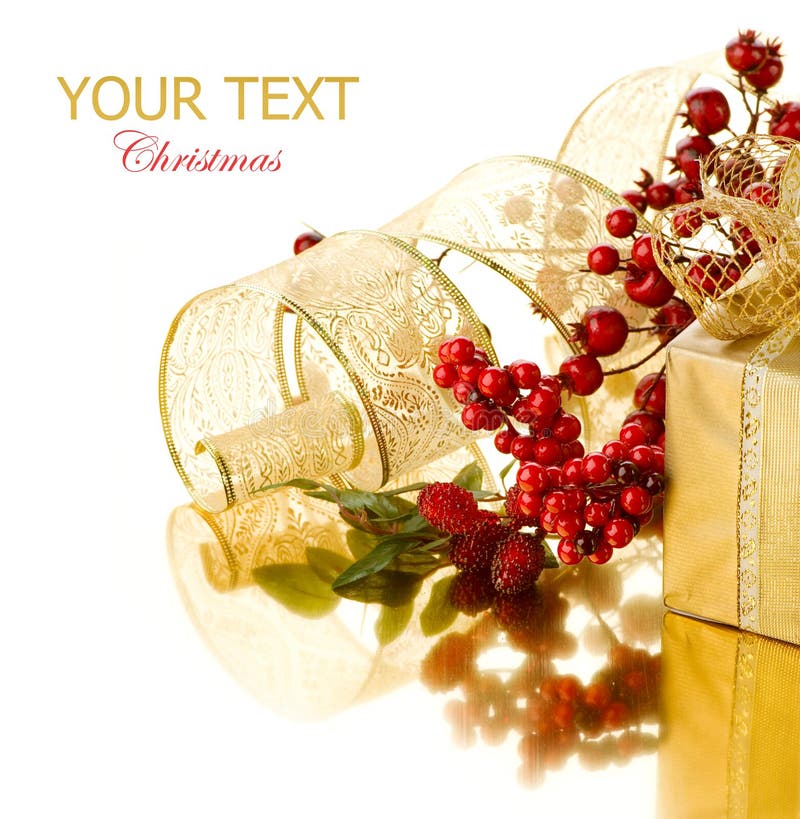 Christmas Gift with Decorations over gold background. Christmas Gift with Decorations over gold background