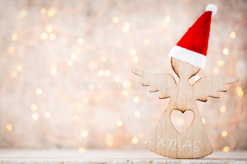 Decoração do Natal com o chapéu de Santa do anjo Fundo dos vintages