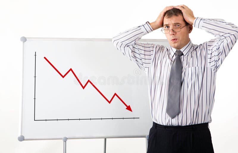 Portrait of frustrated man touching his head with whiteboard representing decreasing graph on it. Decrease stock images, royalty-free photos and pictures