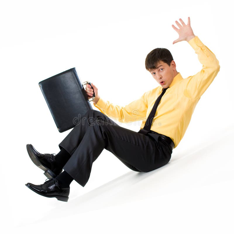 Photo of confused man sliding down during financial crisis. Decrease stock images, royalty-free photos and pictures
