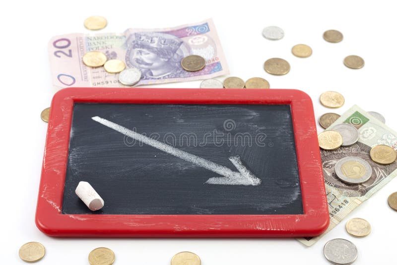 Decrease arrow down on blackboard with polish money. Decrease arrow fall stock images, royalty-free photos and pictures