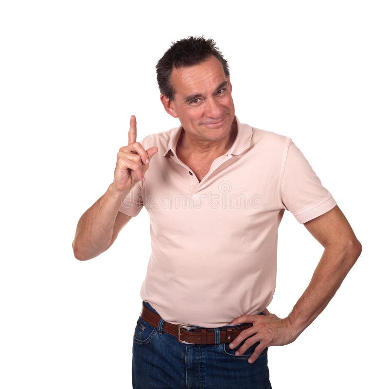 Attractive Smiling Middle Age Man Pointing Upwards or Wagging Finger with Cheeky Grin and Hand on Hip. Attractive Smiling Middle Age Man Pointing Upwards or Wagging Finger with Cheeky Grin and Hand on Hip