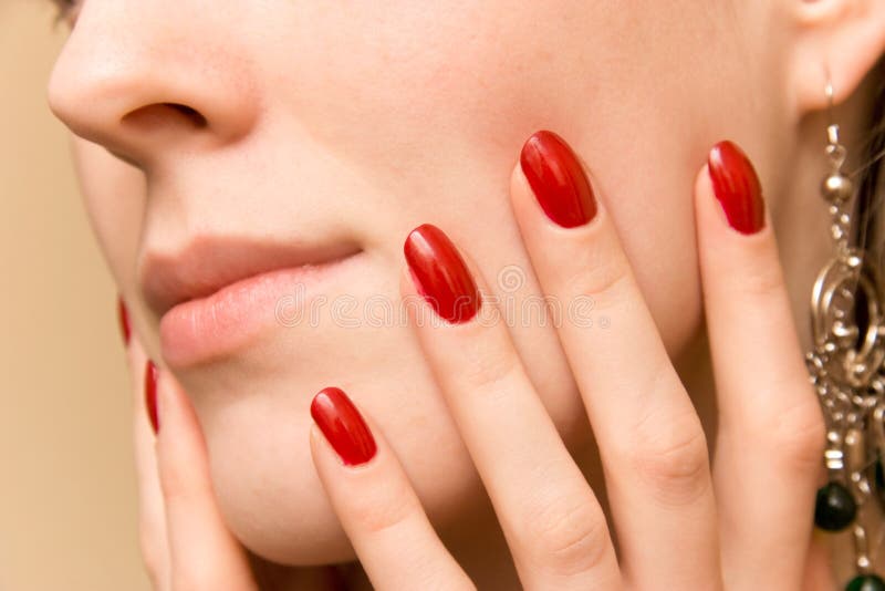 Elegant fingers on woman face. Elegant fingers on woman face.