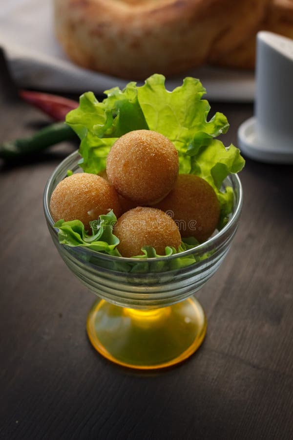 Deep Fried Cheese Balls, Homemade Apetizer with Lettuce Leaves Stock
