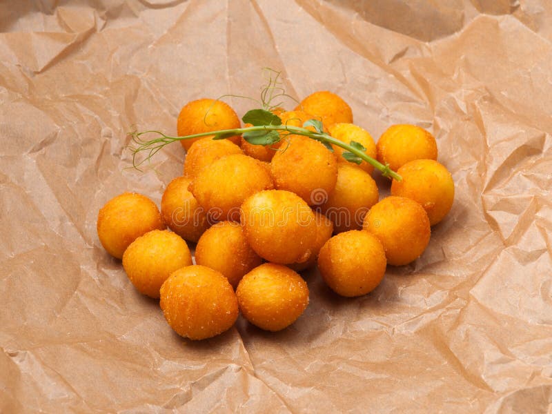 Deepfried Cheese or Potato Balls on Craft Paper Stock Image Image of