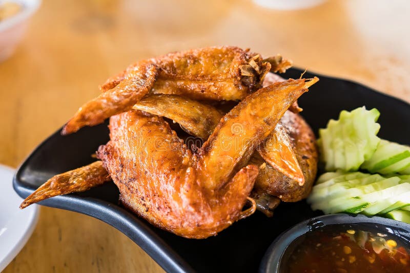 Deep Fried Chicken Wings and Green Fried Herb Leaves, Selective Focus