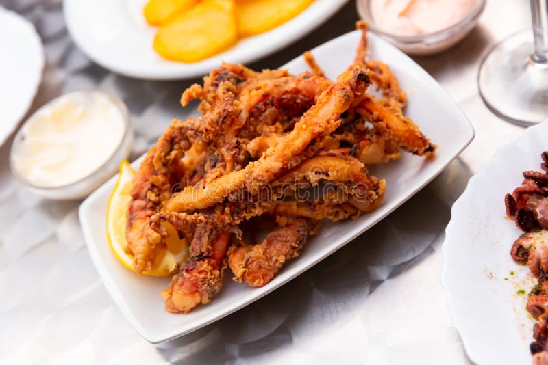 Fried tentacles squid stock image. Image of greens, freshness - 211335811
