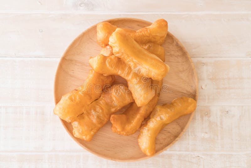 Deepfried dough stick stock photo. Image of plate, white 93714466