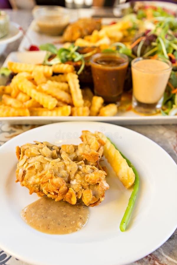 Deepfried Fish Steaks with Almond Flakes Stock Image Image of green