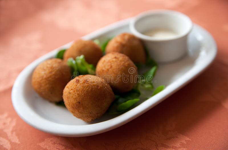 Deep fried fish tapas with salad