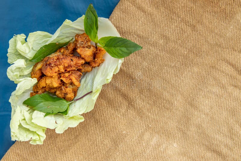 Deep Fried Spicy Minced Chicken with Spicy Thai Herbs Served Stock