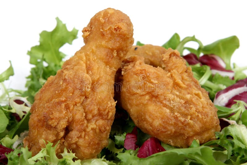 Deep fried spring chicken in golden lemon batter with salad