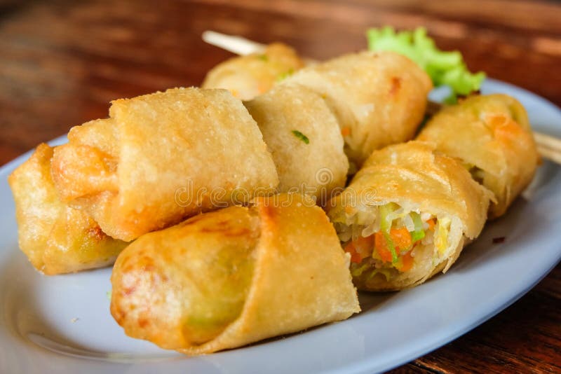 & X22; Deep Fried Spring Roll & X22; Serve on Dish with Salad Vegetable , Thailand. Stock Photo
