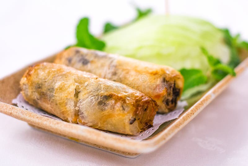 Deep Fried Vietnamese Spring Rolls Wrapped by Fresh Lettuce Stock Photo