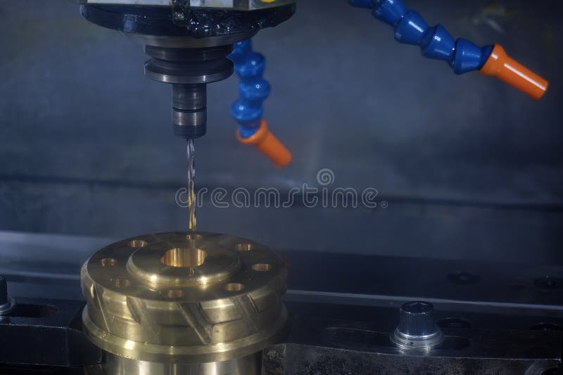 The deep hole drilling process the brass material parts on CNC milling machine royalty free stock images