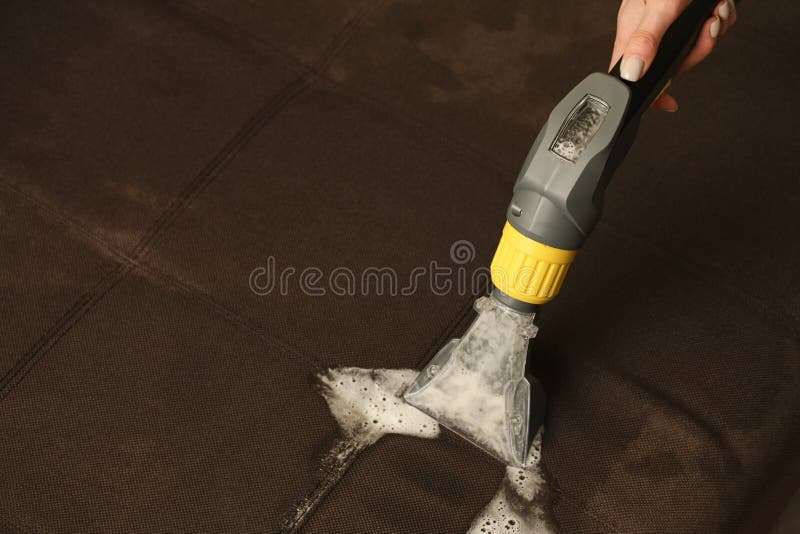 Deep Professional Cleaning of Sofa with Vaccum Cleaner Stock Image