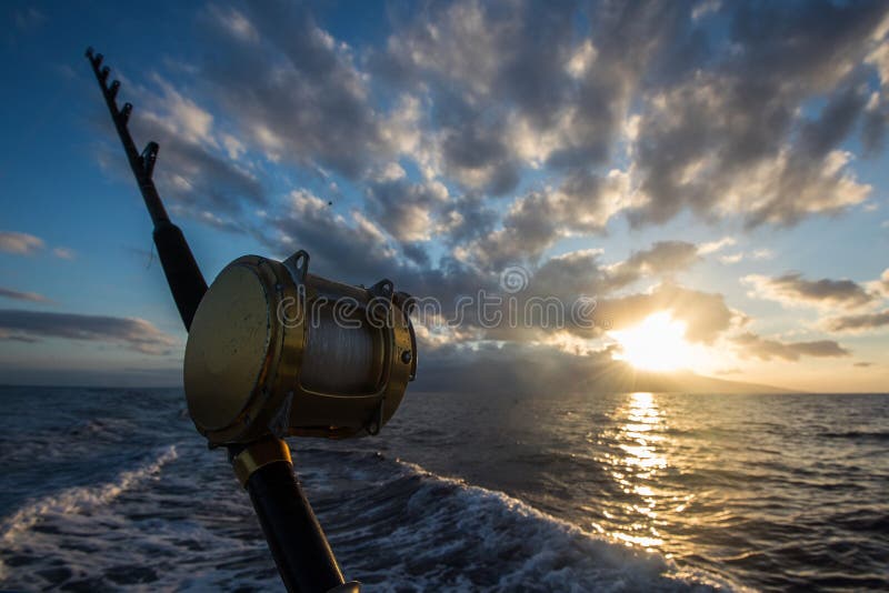 Ocean Fishing Reels Dawn Or Dusk Stock Photo - Download Image Now