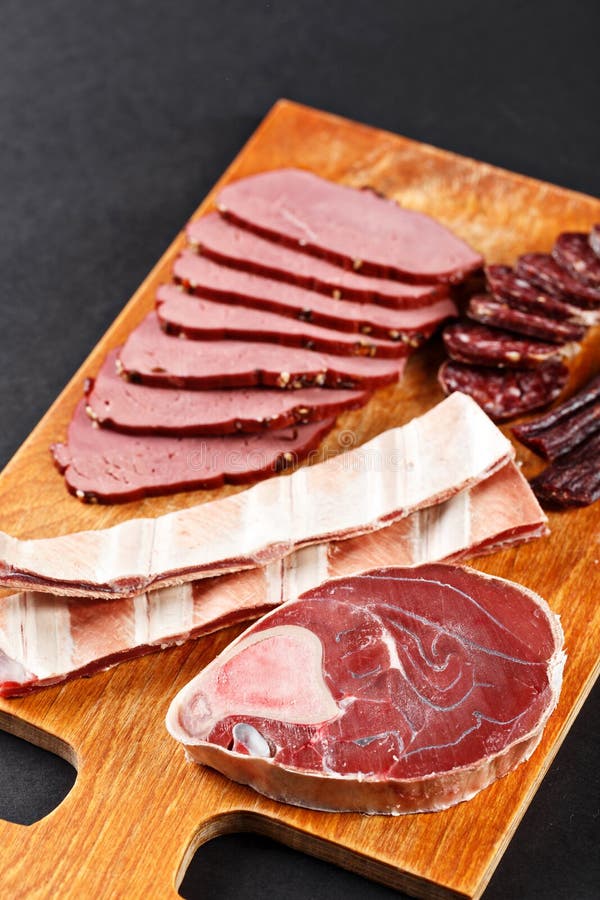 Deer Meat and Sausage on Cutting Board Stock Image Image of herbs