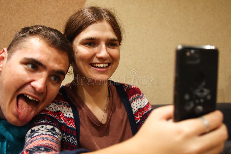 Defocus Young Man And Woman Taking Selfie Couple Or Friends Laughing