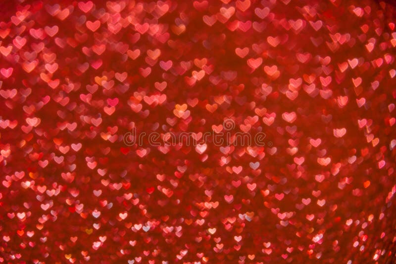 Defocused abstract red hearts light background